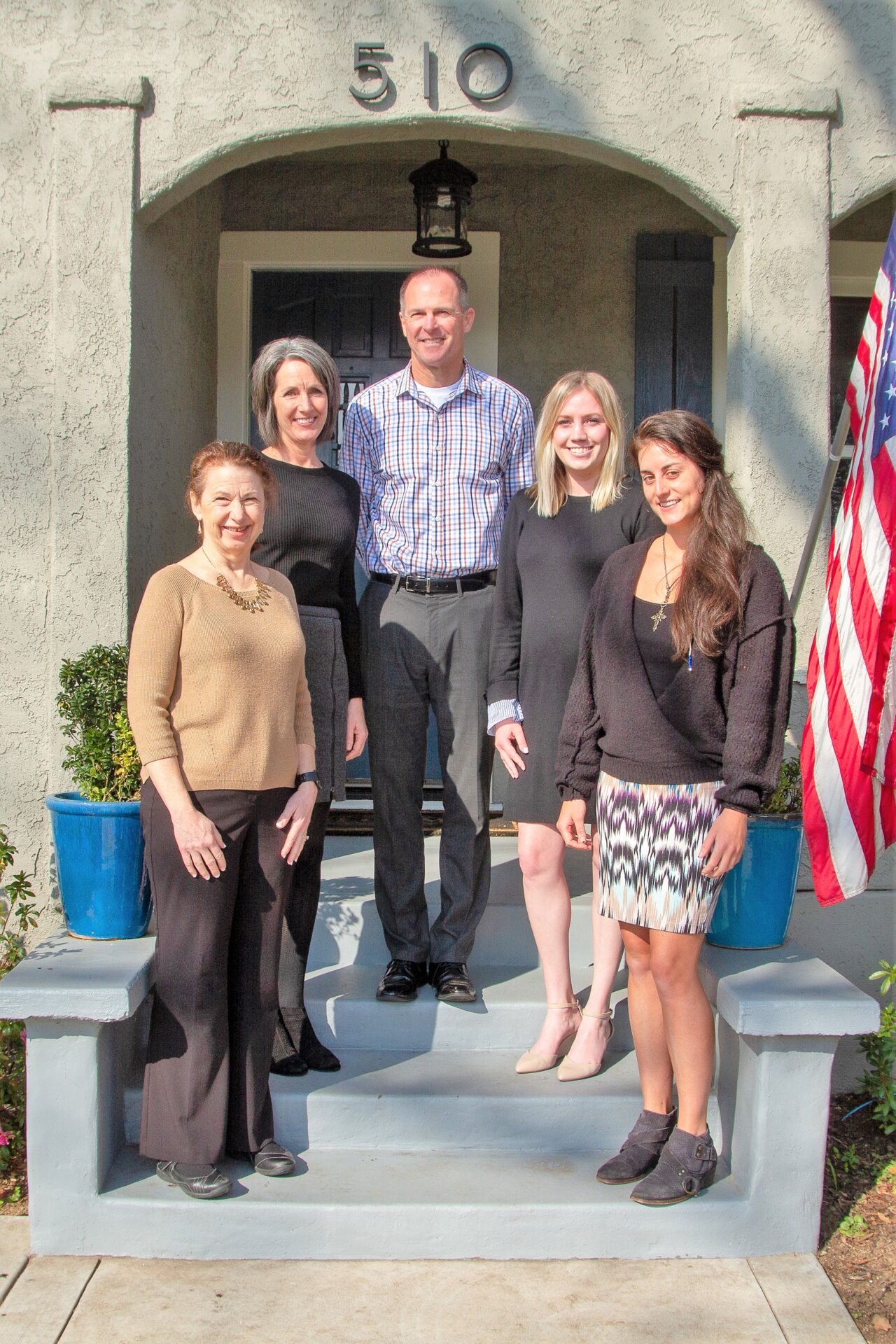 The Carlson Tax Consultants team on the front steps of their office at 510 Oak Street